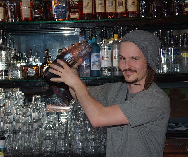 Bartender shaking a cocktail at the No Name Saloon